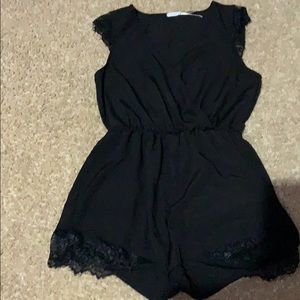 Black romper with lace trim